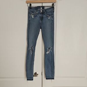 Women's Blue Distressed Jeans With Raw Hem